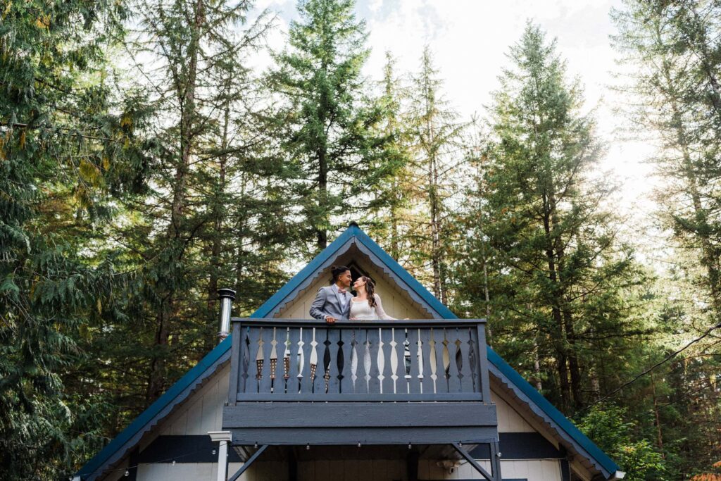 couple smiling on balcony at Ashford WA airbnb