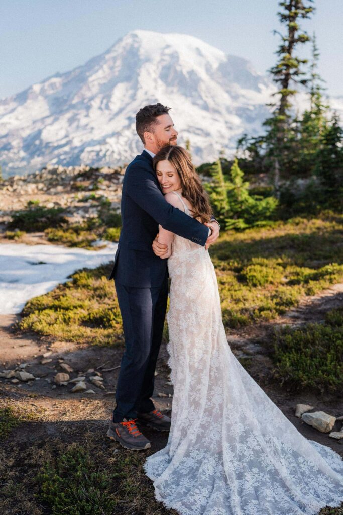 A couple hugs in the chilly weather of their Mount Rainier Elopement