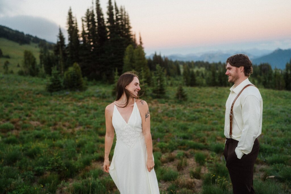 a couple flirting with others during their elopement portraits at Mount Rainier