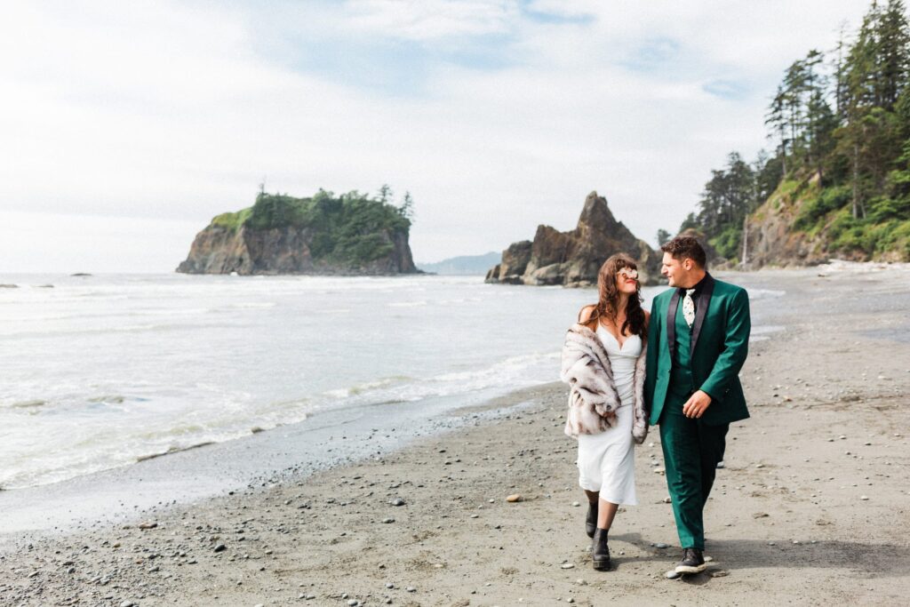 adventurous couple walking on Ruby Beach after their elopement