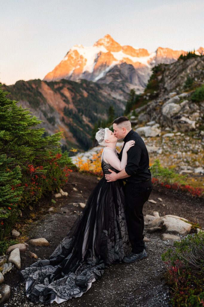 an eloping couple kissing at at sunset during their Artist Point elopement.