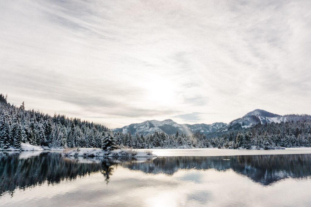 hazy glow over snowy Gold Creek Pond