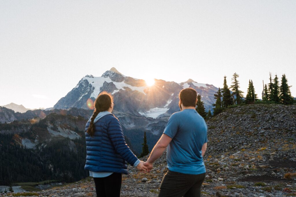 The sun cresting over Mt Shuksan during a sunrise North Cascades Elopement